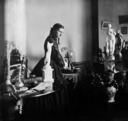 Professor Woolley's residence, interior, woman with statues.